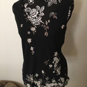Beautiful Top that has floral w/ pearls on Navy.